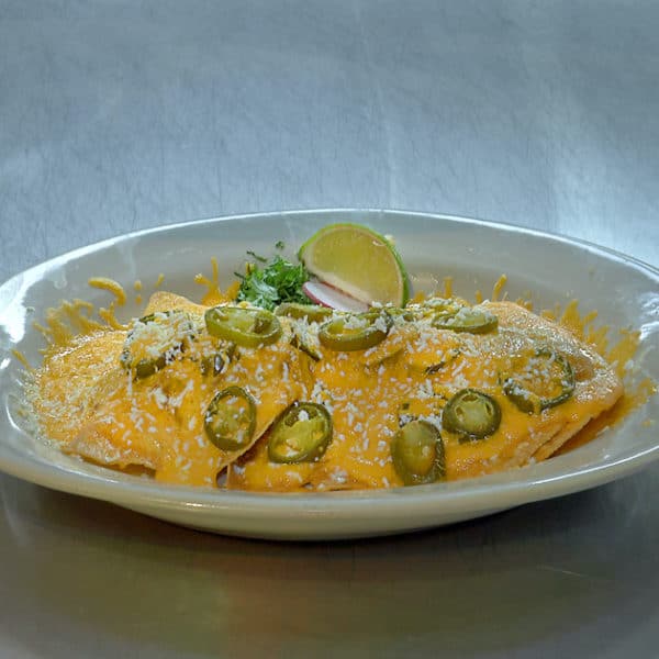 cheesy food with jalapenos, a lime, and a radish from fort worth texas kitchen